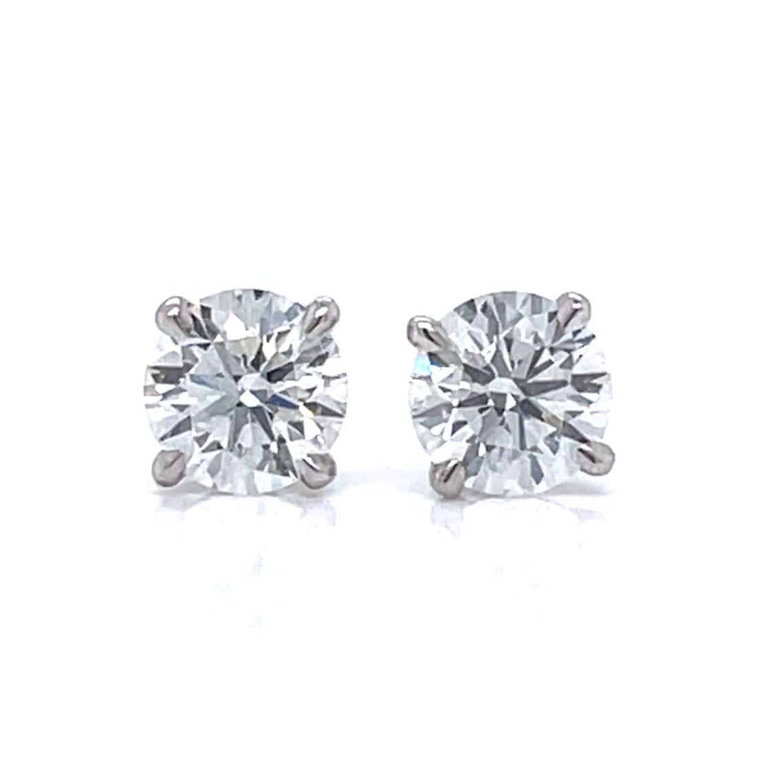 14K White Gold 1.00 Ct. Diamond Stud Earrings: 14K white gold diamond stud earrings set with two diamonds totaling approximately 1.00 CTW in F–G color and VS1–VS2 clarity. Studs. Total weight: 1.0 grams.