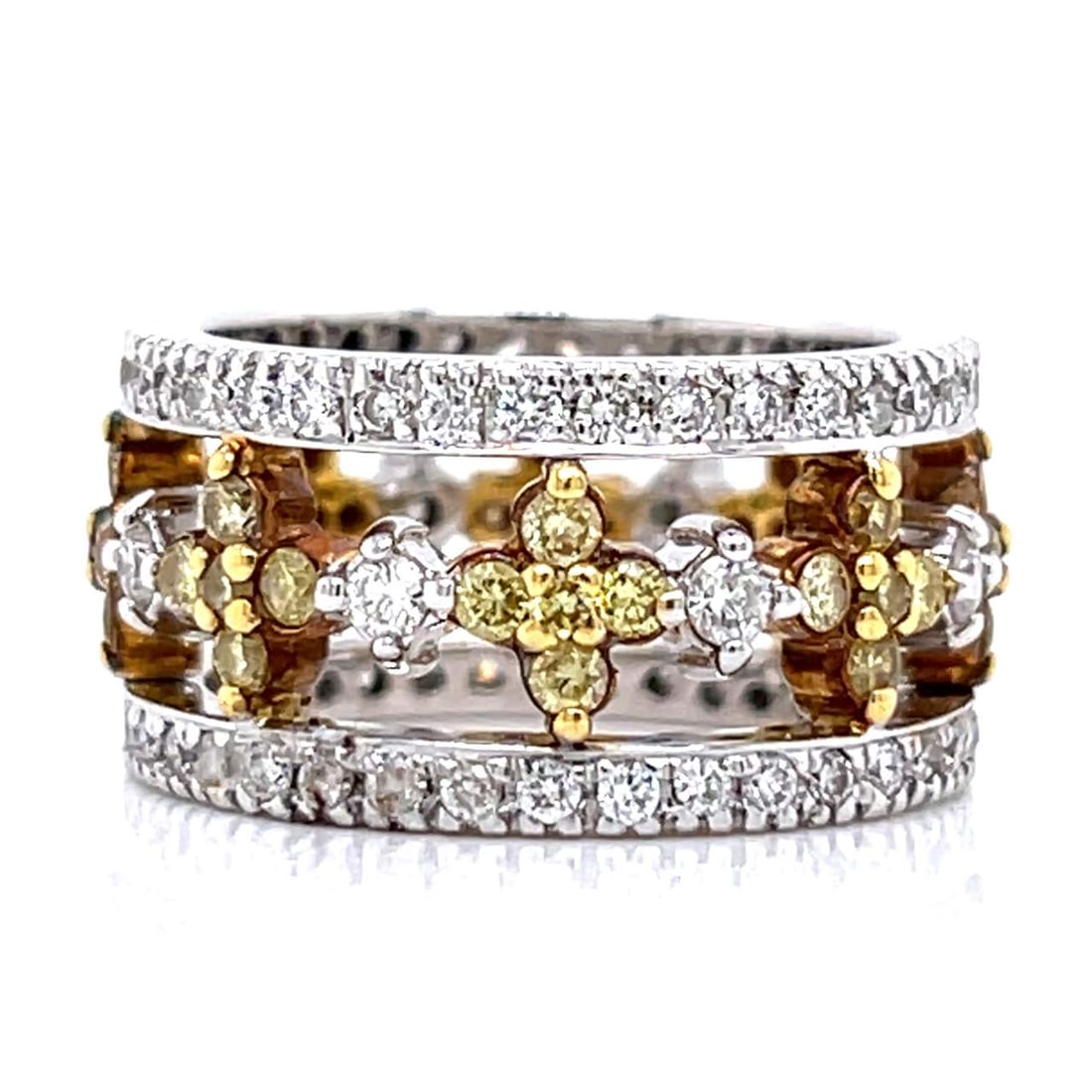 18K White Gold Band Ring with 2.80 CTW in Fancy Intense Yellow Diamond & Diamond: 18K white gold fancy yellow diamond band set with 40 fancy intense yellow diamonds totaling approximately 1.20 CTW in VVS clarity, accented with 80 diamonds totaling approximately 1.60 CTW in F–