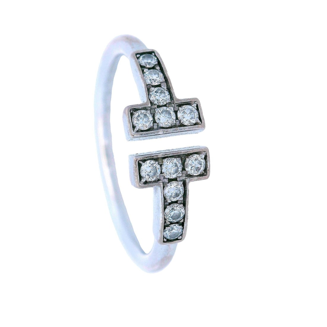 Tiffany & Co. 18k White Gold Diamond T Wire Ring: Tiffany & Co. 18k White Gold T Wire Ring. Accented with 12 Round cut Diamonds weighing together Approx. 0.24 carats. F-G color, VS clarity. Ring size: 6 1/2 to 7. Total weight: 2.5 grams. Stamped: "Ti