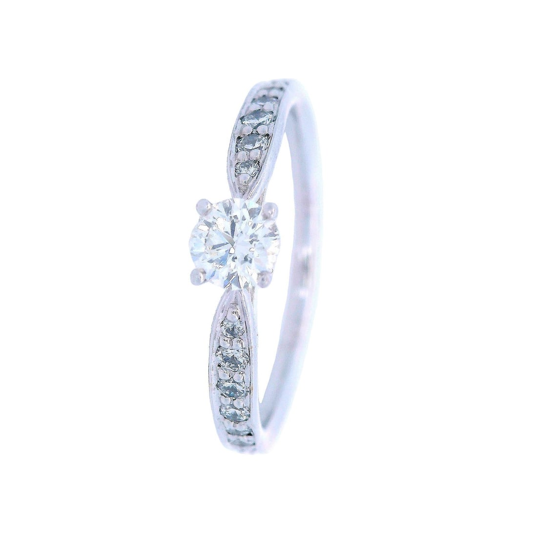Tiffany & Co. Harmony Platinum Engagement Ring with Diamonds: Tiffany & Co engagement Ring crafted in Platinum from the Harmony collection, featuring a 0.21 CTS Round brilliant cut Diamond, G color, VVS clarity. Along with 18 Diamonds on the side, weighing Appro