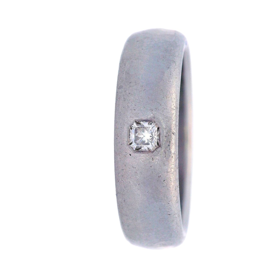 Tiffany & Co. LUCIDA 18kt Gold Ring with Diamond: Tiffany & Co. Hammered engagement Ring crafted in solid 18k white Gold, Featuring a center Diamond Approx. 0.10 carats. F color, VS clarity. Stamped: Tiffany & Co. 750, LUCIDA. Rings size: 9.