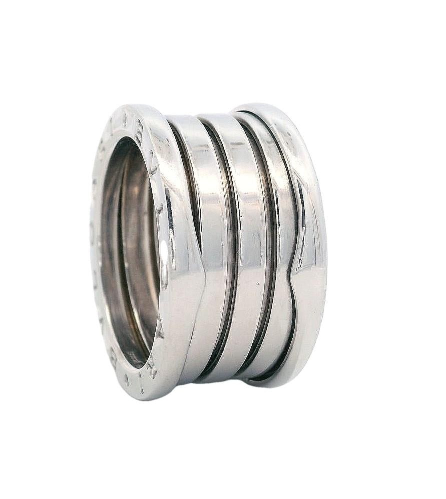Bvlgari Zero-1 18kt white Gold 4 Band Ring size 53: This contemporary Bulgari B.Zero1 ring in size 6.5 (53 European) weighs 10.8 grams and is expertly crafted in 18k white gold with a distinctive four-band design inspired by Rome's Colosseum. Measuring