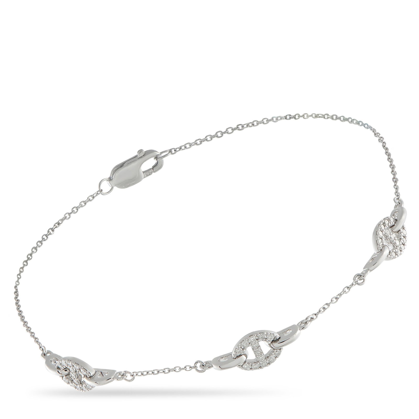 18K White Gold 0.20ct Diamond Bracelet: Stylish chain link motifs give this 18K White Gold bracelet a classically elegant design that will never go out of style. Elevated by Diamonds totaling 0.20 carats, this piece is simple, understated, 
