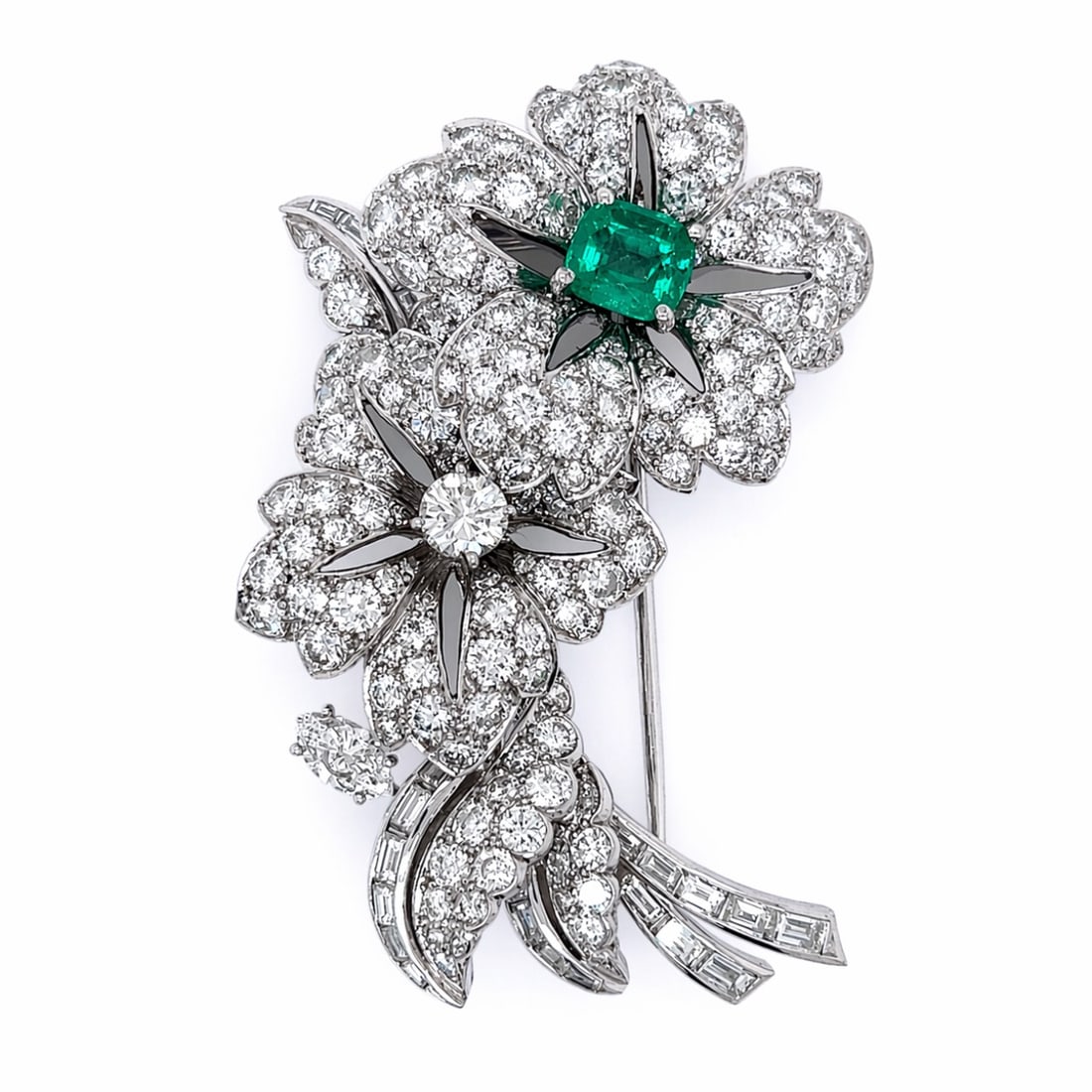 Art Deco Platinum Brooch with 9.90 CTW in Colombian Emerald & Diamond: Art Deco platinum flower brooch set with an approximately 1.50 CTW Colombian emerald, accented with diamonds totaling approximately 8.40 CTW in D–F color and VVS–VS clarity for exceptional
