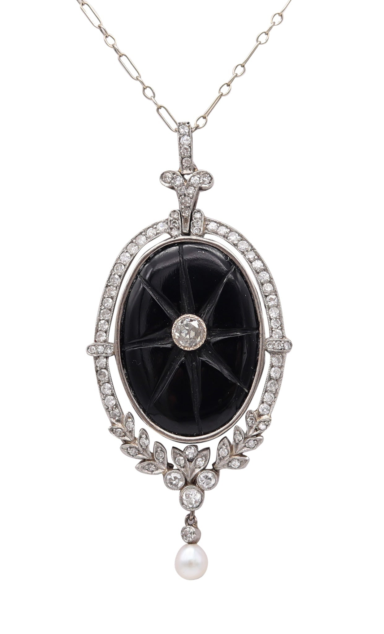 BELLE EPOQUE 1900 Edwardian Necklace In Platinum Diamonds, Onyx & Natural Pearl: Edwardian/Belle Époque pendant necklace, New York City, circa 1900, crafted in tested .900 platinum and designed in the era’s airy white-on-white aesthetic. The elegant pendant (61 x 27mm) 