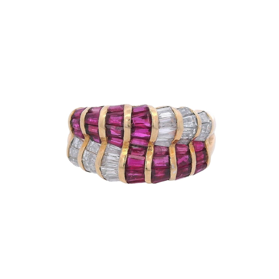 18K Yellow Gold Ring with 2.75 CTW in Rubies & Diamonds: Striking 18K yellow gold band ring designed in bold, sculptural rows, set with 30 calibrated tapered baguette Rubies totaling approximately 1.60 ctw and 22 tapered baguette diamonds totaling approxima