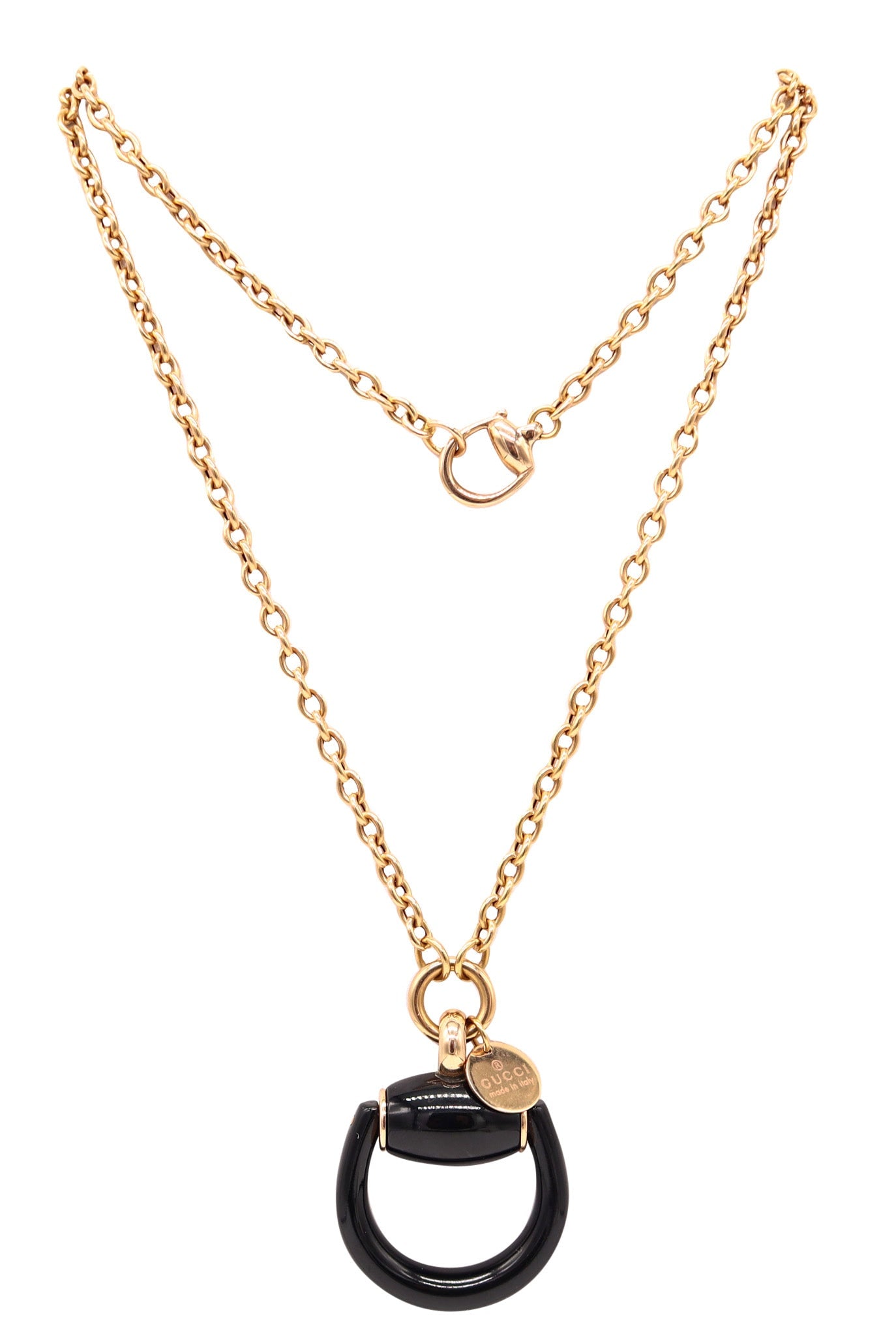 GUCCI Milano Enameled Horsebit Dangle Drop Necklace-Pendant In 18Kt Yellow Gold: Beautiful vintage Gucci necklace, Milano, circa 1990s, featuring a horsebit-shaped pendant crafted in solid 18K yellow gold with a high-polish finish and striking black enamel applications. Suspended 