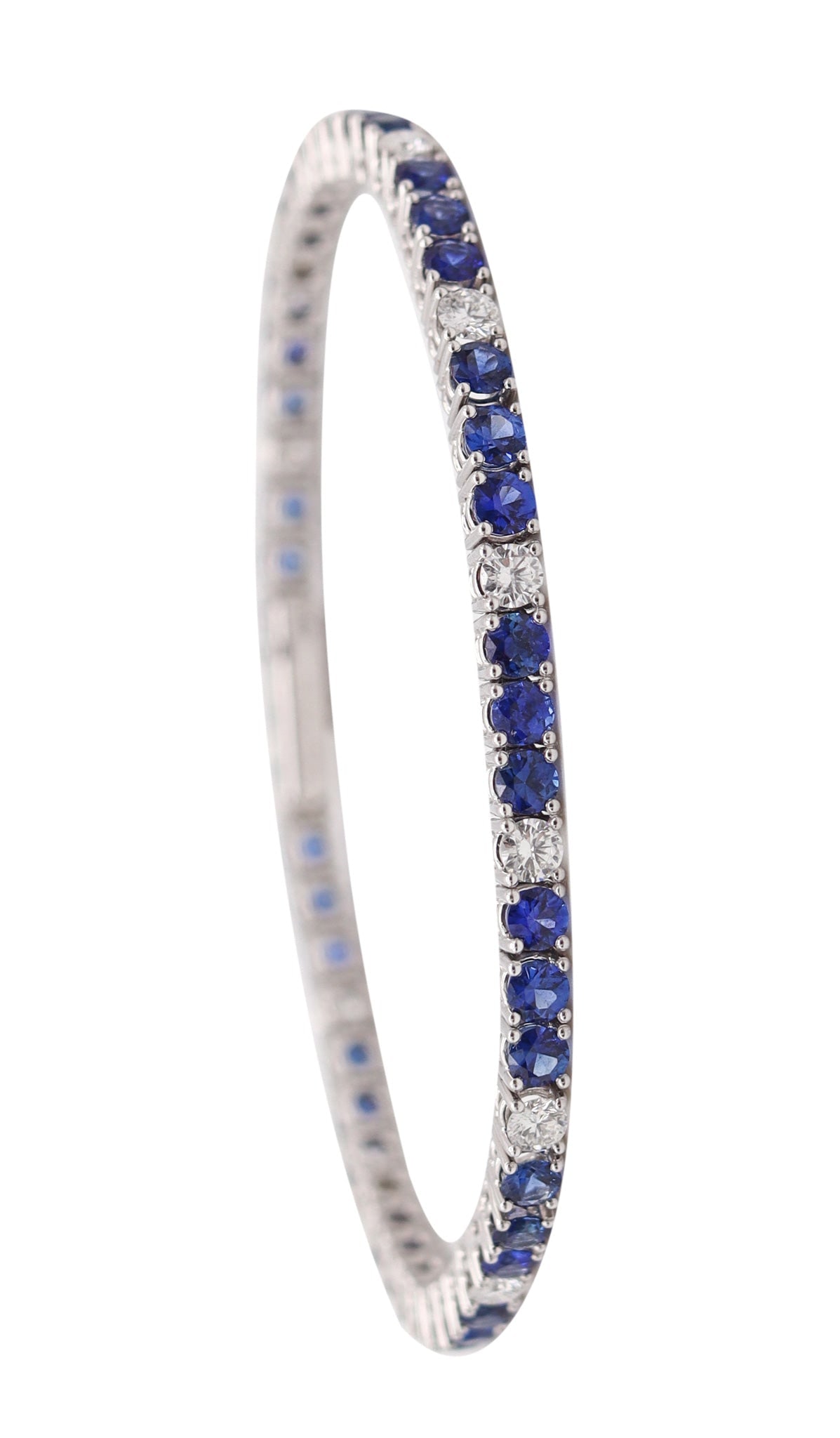 GÜBELIN Riviera Bracelet In 18Kt White Gold With 7.35 Ctw Diamonds & Sapphires: Exceptional Gübelin riviera bracelet, Zürich, circa 1980–1990, crafted in solid 18K white gold with a high-polish finish and set with 54 perfectly calibrated gemstones. Mounted in flat