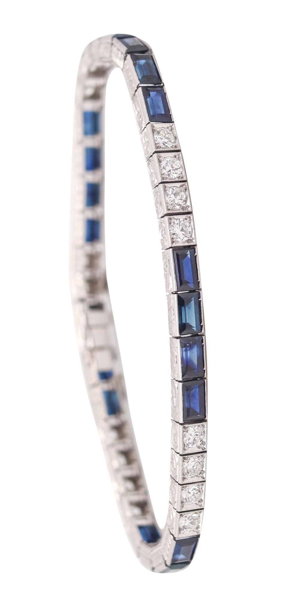 J.B. CALDWELL 1925 Bracelet In Platinum With 8.58 Ctw In Diamonds & Sapphires: Superb Art Deco riviera station bracelet by J.B. Caldwell, America, circa 1925, impeccably crafted in platinum/iridium (.900 plat, .100 irid) with high-polish finish, geometric engraved sides, and cri