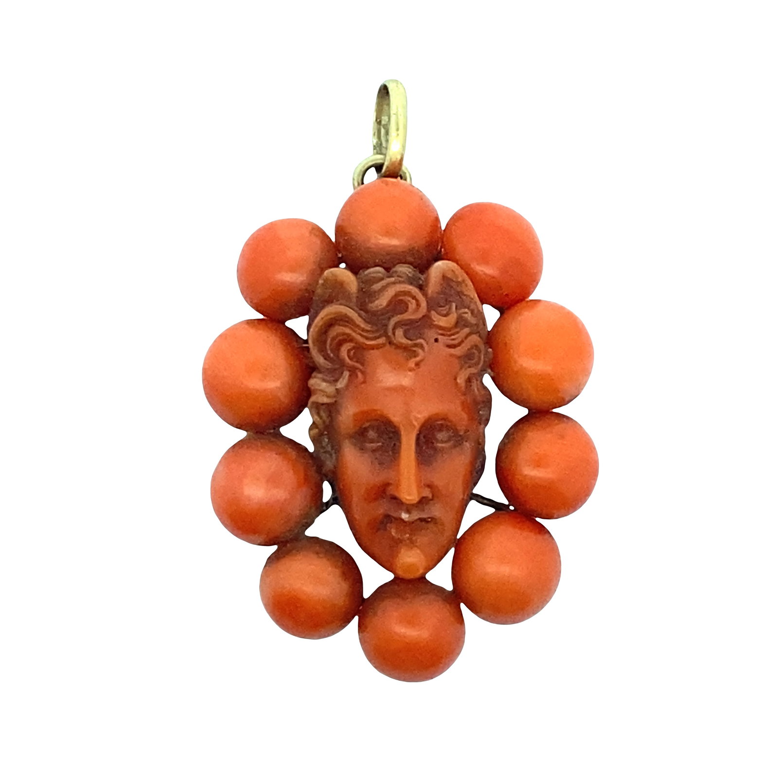 Antique 18K Yellow Gold Pendant with Carved Coral: Antique 18K yellow gold coral pendant featuring a finely carved central face framed by ten polished coral spheres, all secured within an elegant gold gallery that gives the piece strong dimension and 