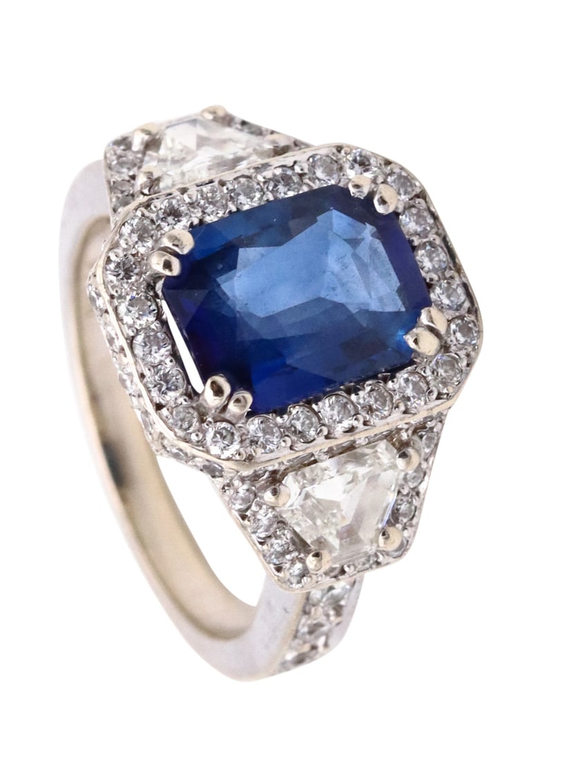 Barmakian Brothers Ring In 18Kt White Gold With 4.47 Ctw In Calf Cut Diamonds And Sapphires: Beautiful modern ring by the Barmakian Brothers (New England), crafted in solid 18K white gold with a high-polish finish and classic, refined lines. Set in a four double-prong mount with a vivid blue 