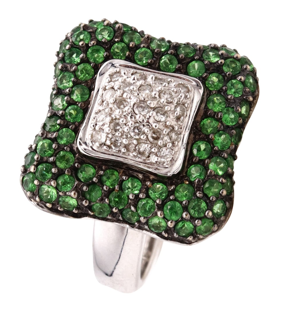 ITALIAN Modern Ring In 18Kt White Gold With 2.34 Cts In Diamonds And Tsavorites: Modern Italian cocktail ring crafted in solid 18K white gold with a high-polish finish and a vibrant green-and-white palette. Set with 72 round faceted vivid green tsavorite garnets in flush prong set