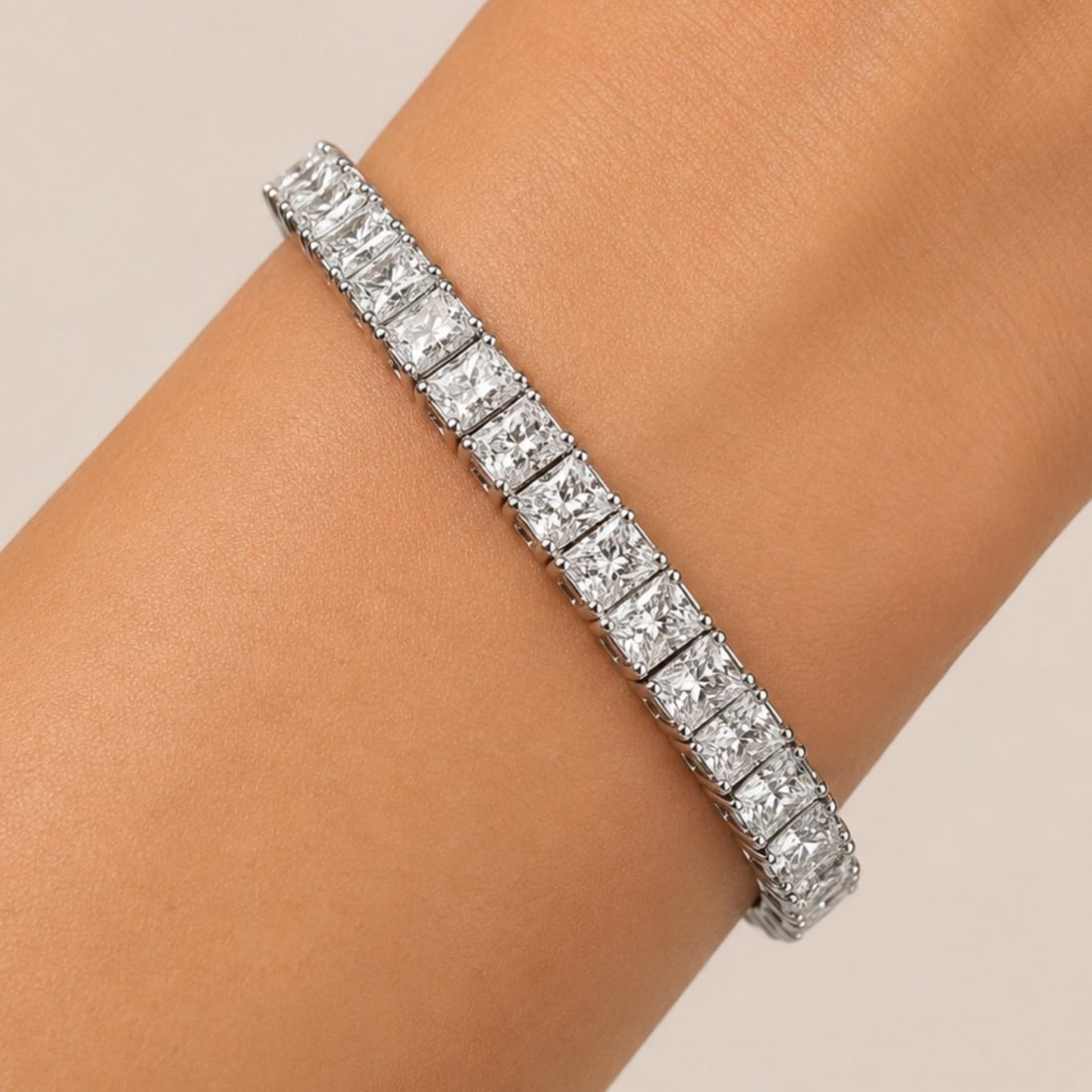 Platinum Bracelet with 21.50 CTW in Diamond: Showstopping tennis bracelet crafted in platinum, set with 43 radiant-cut diamonds (approx. 21.50 CTW) in a continuous line for bold, high-jewelry brilliance. The radiant cuts deliver a crisp, modern 