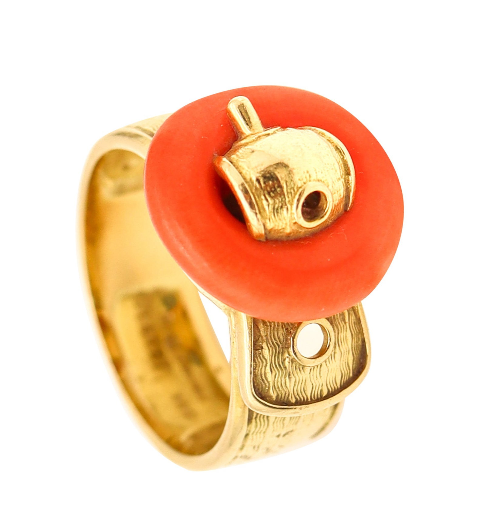 PIAGET Paris 1970 Modernist Belt-Shaped Ring In 18Kt Yellow Gold With Coral: Striking belt-inspired Piaget ring, Paris, crafted in the early 1970s in solid 18K yellow gold with a polished finish. The band is intricately engraved to resemble a real belt, topped with a natural c