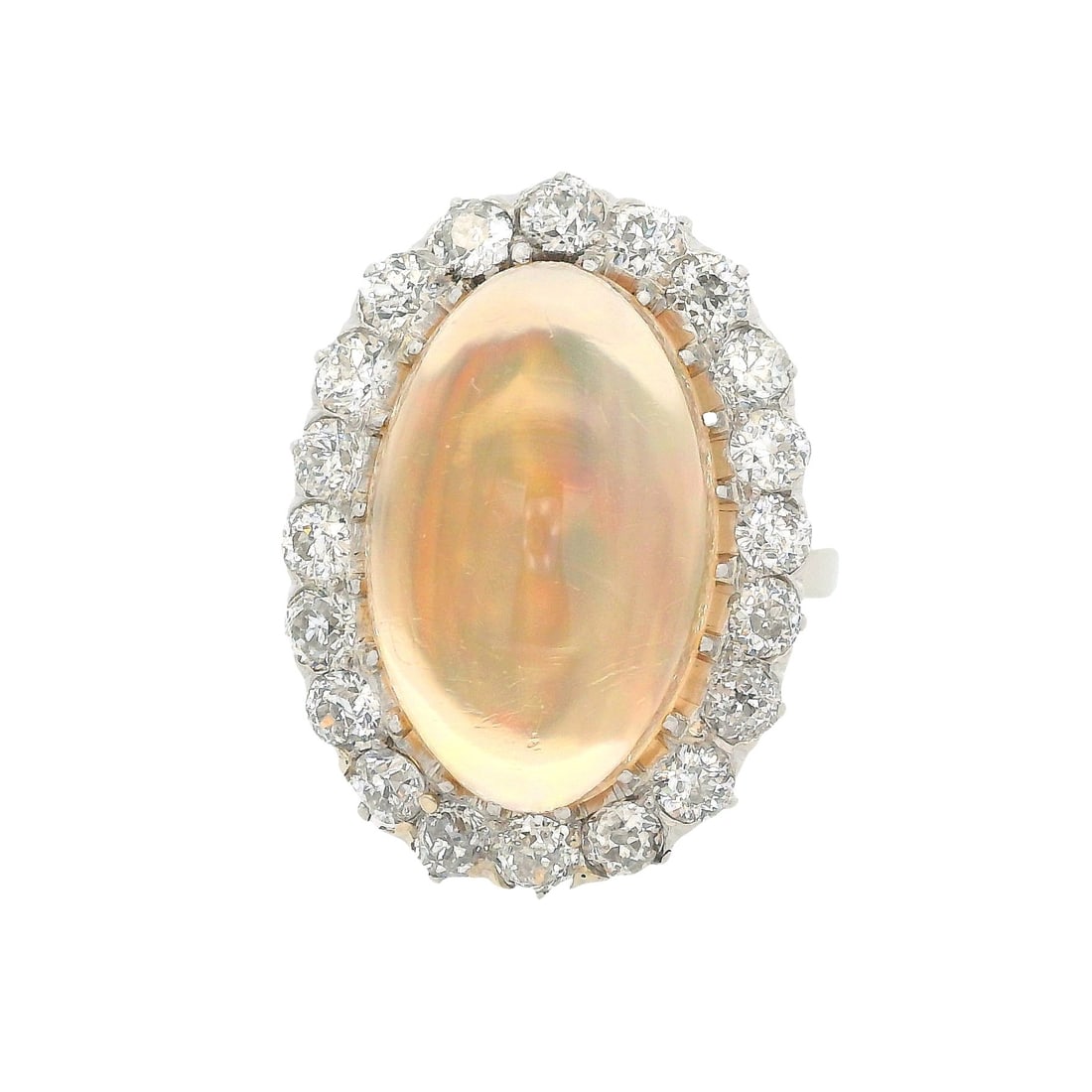 Platinum Cocktail Halo Ring with 11.60 CTW in Opal & Diamonds: Showstopping platinum cocktail halo ring featuring a luminous cabochon opal of approximately 10.00 carats, framed by a sparkling halo of 20 old mine-cut diamonds totaling approximately 1.60 carats, gr