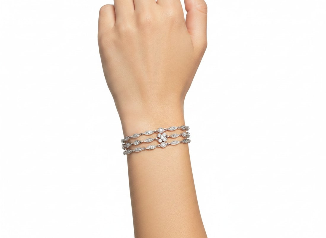 14K White Gold & Platinum Bracelet with 2.30 CTW in Diamonds: Refined 14K white gold and platinum bracelet featuring an elegant vintage-inspired link design with milgrain detailing, set throughout with round diamonds totaling approximately 2.30 carats for contin