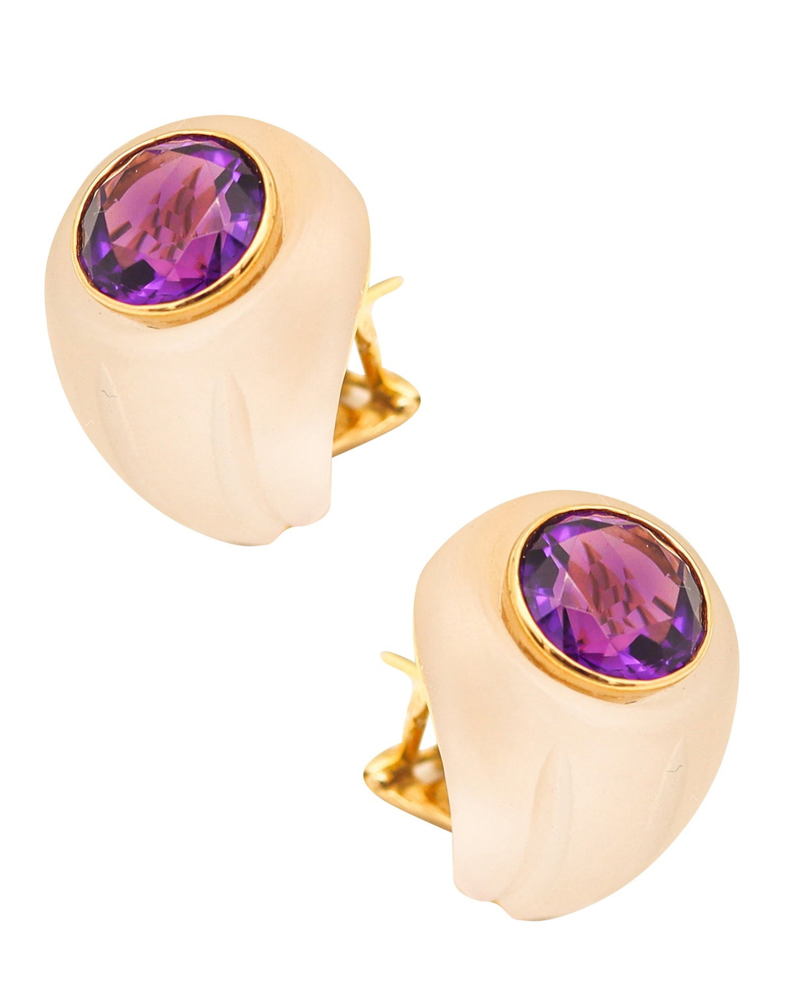 PETOCHI Rock Quartz Clips-On Earrings In 18Kt Yellow Gold With Round Amethysts: Classic clip-on earrings by G. Petochi, Rome, Italy, crafted in solid 18K yellow gold with a polished finish. Set with two translucent rock quartz carvings and a well-matched pair of round faceted viv