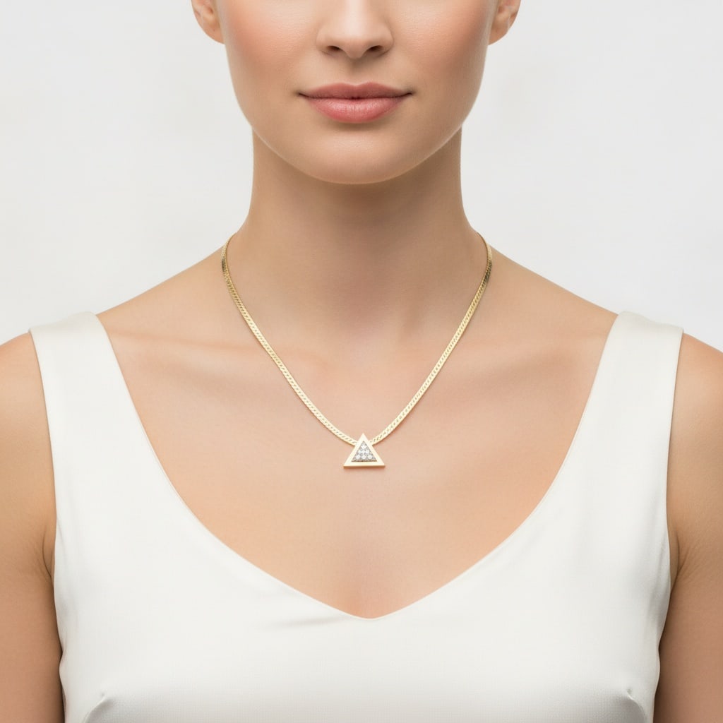 18K Yellow Gold & Platinum Triangle Pendant Necklace with 1.00 CTW in Diamonds: Sleek mid-century 18K yellow gold and platinum pendant necklace featuring a bold triangular motif with a platinum-set cluster of three round-cut diamonds totaling approximately 1.00 CTW, graded H colo