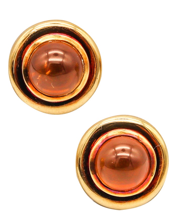 Tiffany Co. By Paloma Picasso Clips Earrings In 18Kt Yellow Gold With Citrines: Vintage clip-on earrings by Paloma Picasso for Tiffany Studios, New York City, late 1980s, crafted in solid 18K yellow gold with a high-polish finish. Bezel set with two round cabochon Brazilian inten