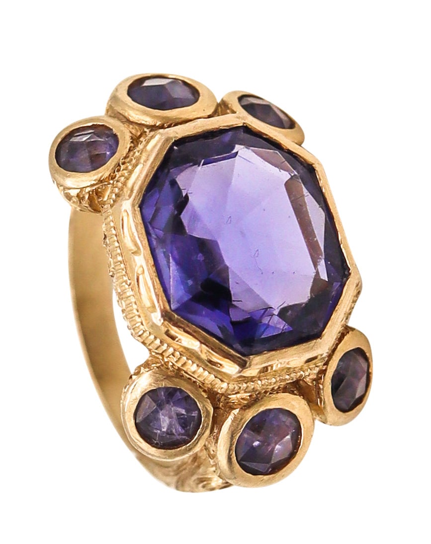 MONICA ROSSI Milan For Anaconda Cocktail Ring 19Kt Yellow Gold 5.79 Cts In Iolites: Monica Rossi cocktail ring for Anaconda, Milan, Italy, hand crafted in rich 19K yellow gold (.800 fineness; equivalent approx. 19.22K) with an incised Baroque-inspired pattern. Set with seven purplish