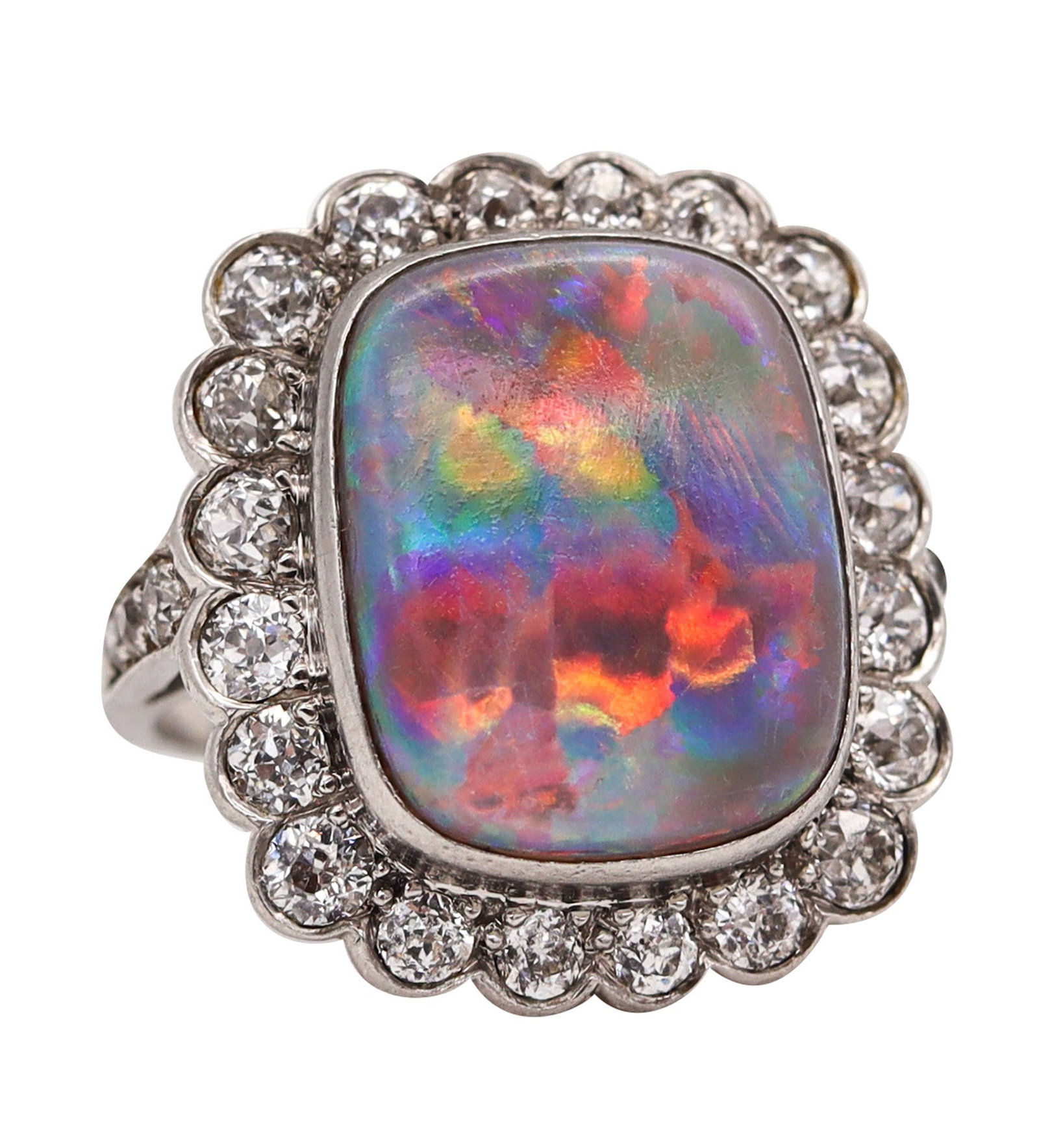 ART DECO 1930 Cocktail Ring In Platinum With 6.12 Cts Australian Opal & Diamonds: Exceptionally beautiful Art Deco ring, circa 1930s, crafted in solid platinum in a bold cushion-shaped design with crisp geometric lines and fine millegrain throughout. Centered with a bezel-set cushi