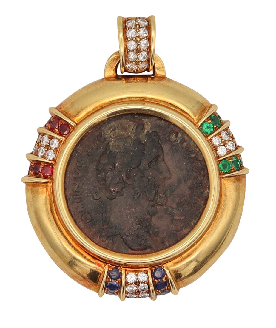 Ancient Roman Coin Pendant In 18Kt Gold With 3.97 Ctw In Diamonds Rubies Sapphires And Emeralds: Oversized coin pendant by Jean Paris, Paris, late 20th century, crafted in solid 18K yellow gold with a high-polish finish and a movable bail for chain wear. Centered with an authentic ancient Roman b
