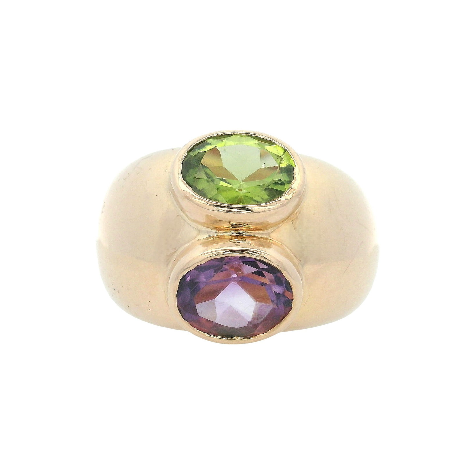 FRENCH Bombe 18K Yellow Gold Ring with 2.60 CTW in Peridot & Amethyst: French vintage bombe ring crafted in solid 18K yellow gold, featuring a bold domed silhouette set with an oval peridot approx. 1.30 ctw and an oval amethyst approx. 1.30 ctw for vivid green-and-purple