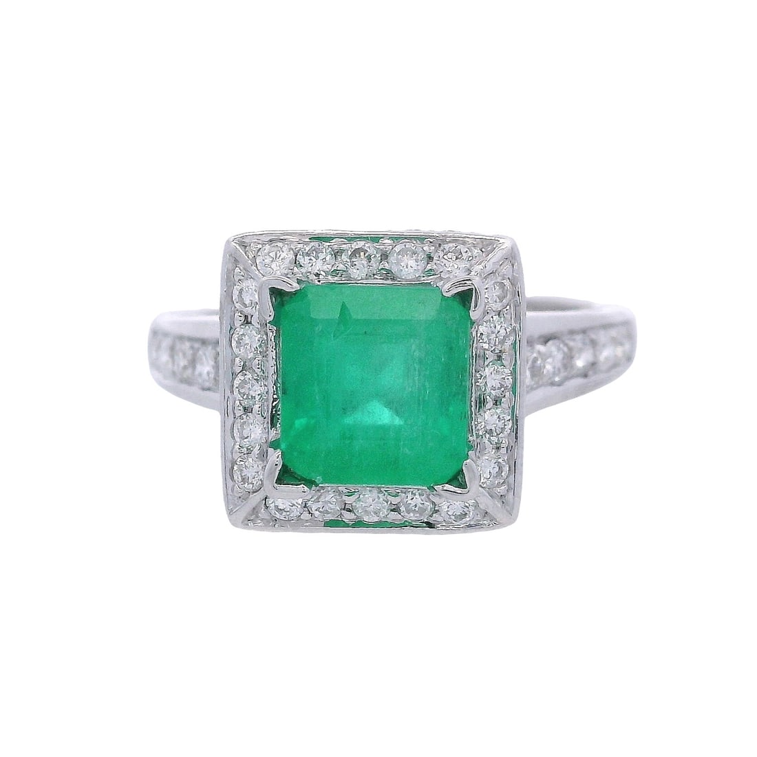 18kt white Gold Cocktail Ring with 2.45 CTW in Emerald & Diamonds: 18kt white Gold Engagement Ring set with a center emerald cut Emerald of Approx. 1.55 carats. Embellished with Round cut Diamonds weighing together Approx. 0.95 carats. F-G color, VS1-2 clarity. Ring 