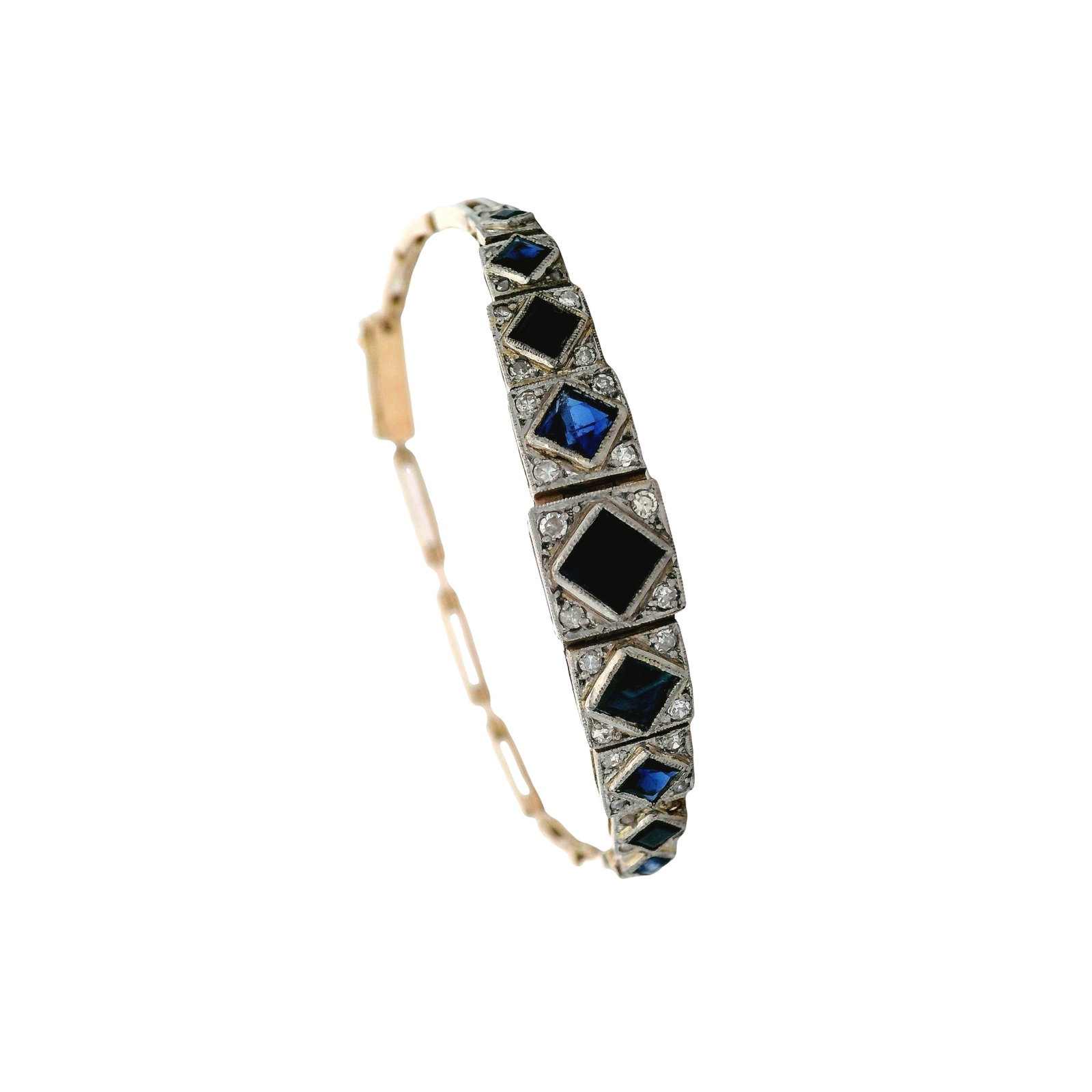 Art Deco 18K Yellow Gold & Platinum Bracelet with 2.10 CTW in Sapphires & Diamonds: Art Deco bracelet crafted in 18K yellow gold with platinum-topped settings, featuring nine graduated blue sapphires totaling approx. 2.00 ctw (center sapphire is synthetic), accented with single-cut a