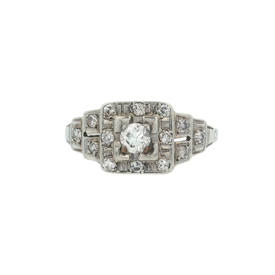 Antique 18K White Gold Engagement Ring with 0.18 CTW in Diamond: Antique 18K white gold engagement ring centered with an old mine-cut diamond approx. 0.18 ctw (J color, SI1 clarity) in a classic octagonal head with delicate openwork shoulders. Size 6. Total weight 