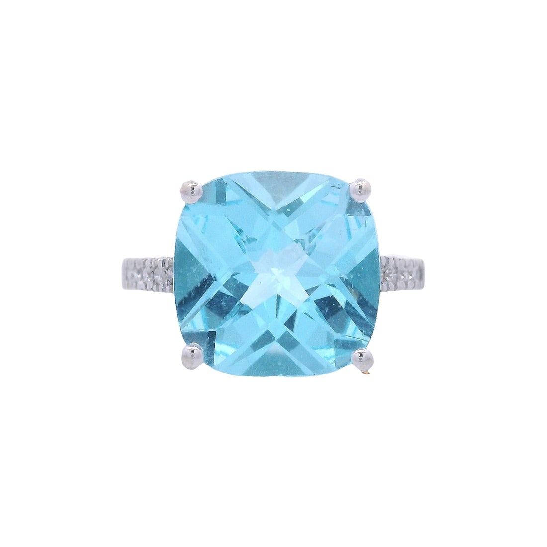 14kt white Gold Cocktail Ring with Blue Topaz and Diamonds: Cocktail Ring crafted from 14kt white Gold, set with a center Blue Topaz Approx. 4.00 carats. Along with 10 Round cut Diamonds on the shoulders weighing together Approx. 0.10 carats. H color. Ring siz