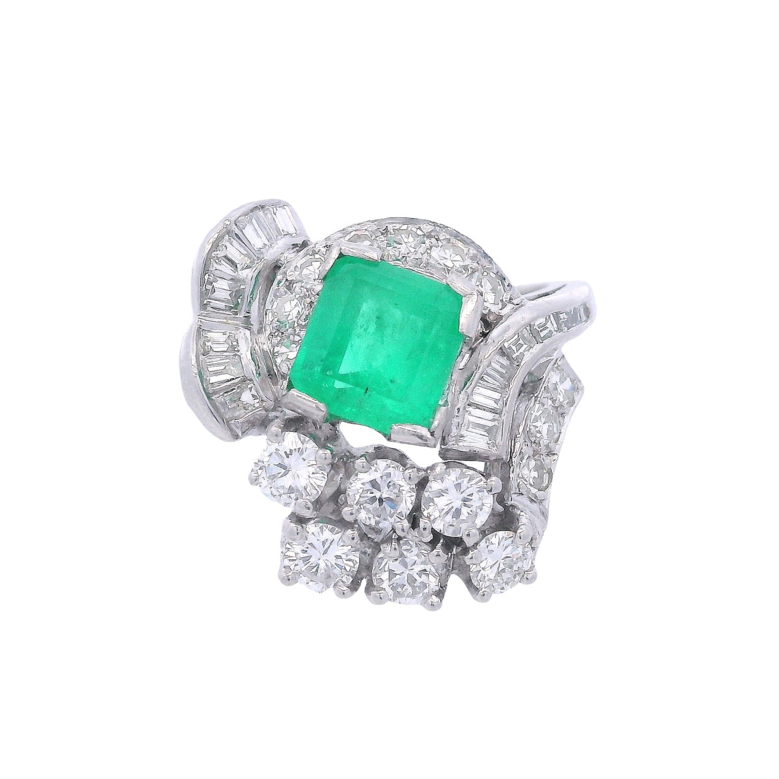 Platinum Cocktail Ring with 2.72 CTW in Emerald & Diamonds: Platinum Cocktail Ring set with a center Emerald cut Emerald of Approx. 1.30 carats. Along with Round cut, Single cut and Baguette cut Diamonds weighing together Approx. 1.42 carats. G-H color, VS