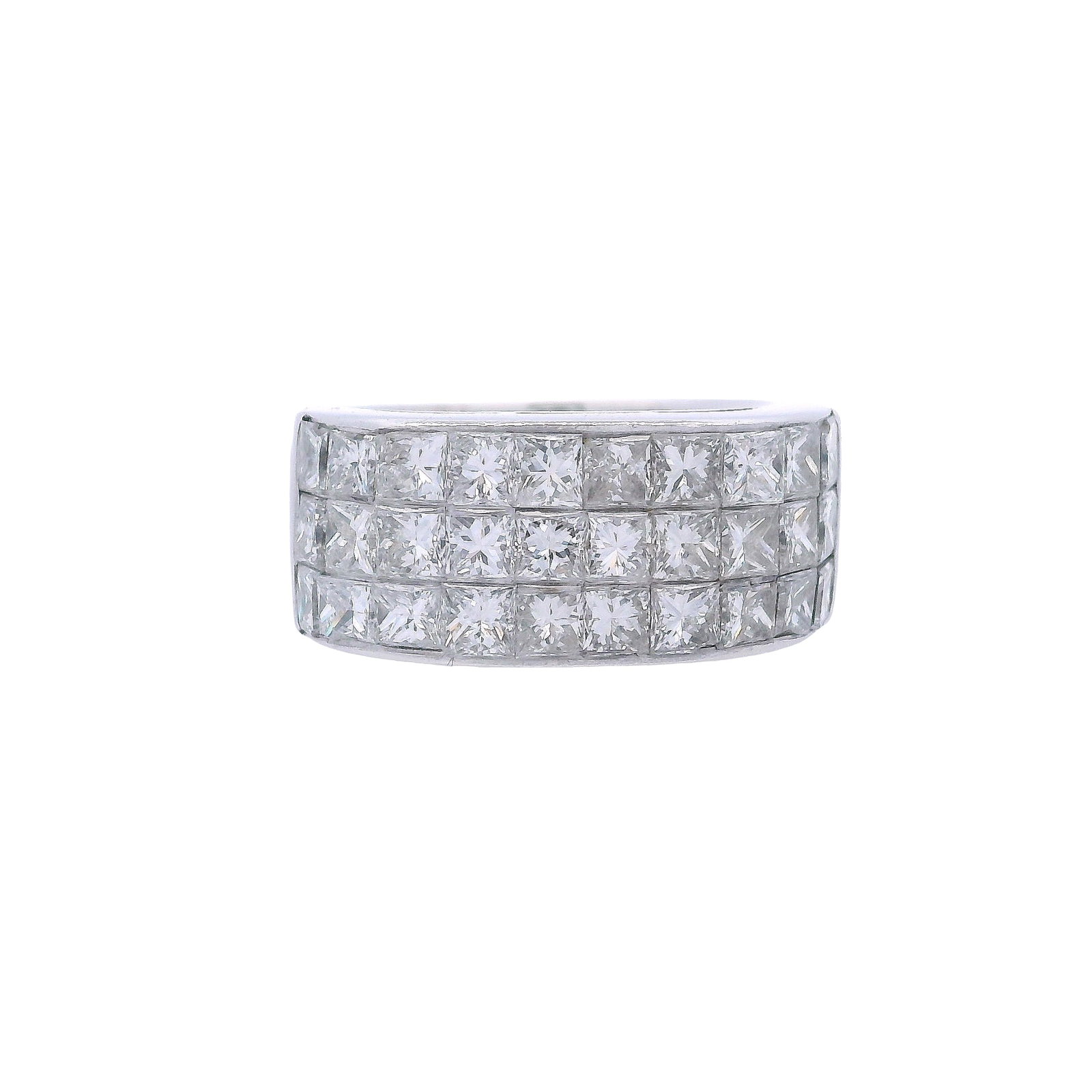 18kt white Gold Ring with 2.05 Cts Diamonds: Geometric Ring crafted in 18kt white Gold featuring an invisible set of 30 square cut Diamonds weighing together Approx. 2.05 carats. H color, VS2 clarity. Ring size: 4.5. Total weight: 9.4 grams. Rin