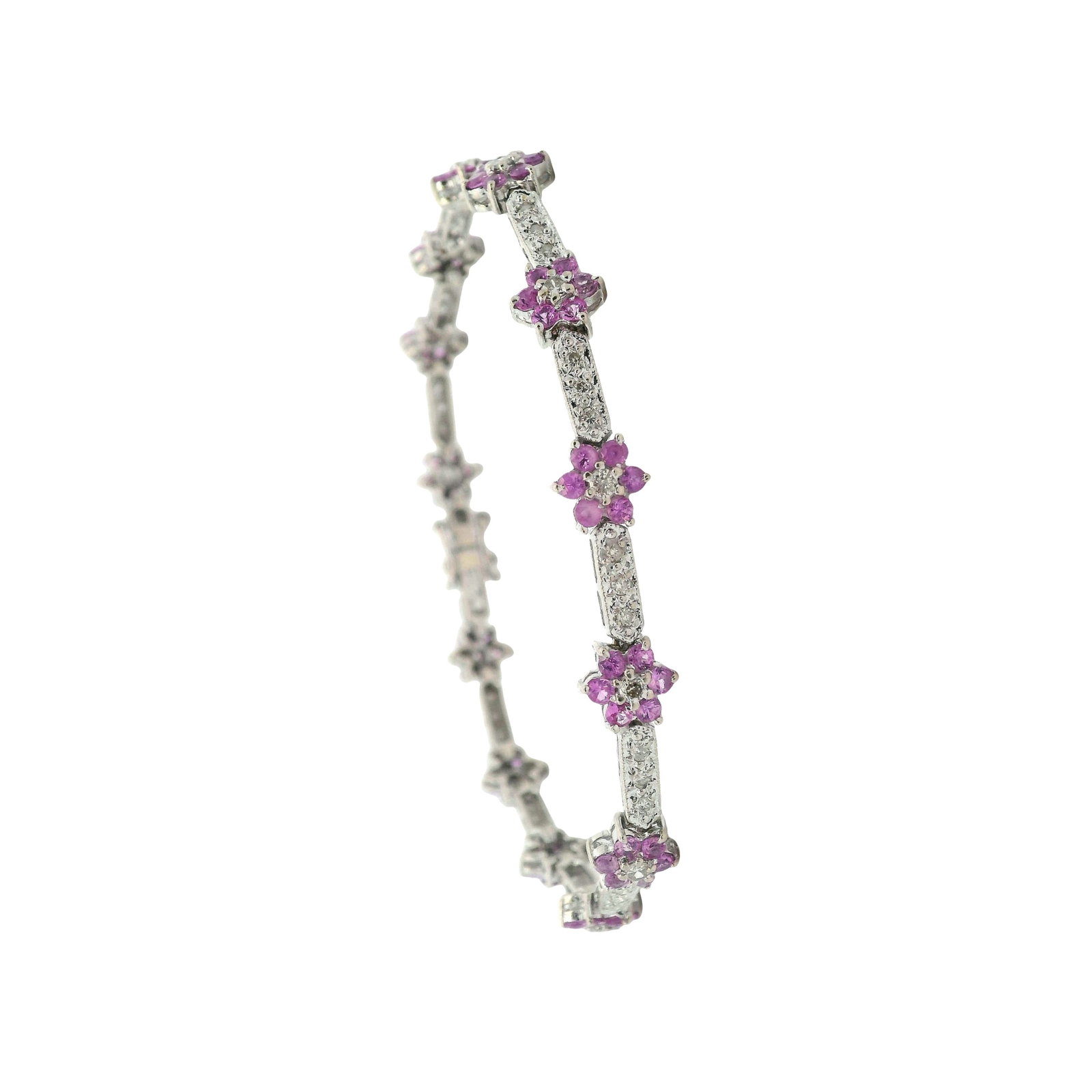14K White Gold Flower Bracelet with 4.85 CTW in Pink Sapphires & Diamonds: 14K white gold flower bracelet set with round pink sapphires totaling approx. 4.00 ctw, accented with round diamonds totaling approx. 0.85 ctw (H color) for a combined approx. 4.85 ctw. Measures appro