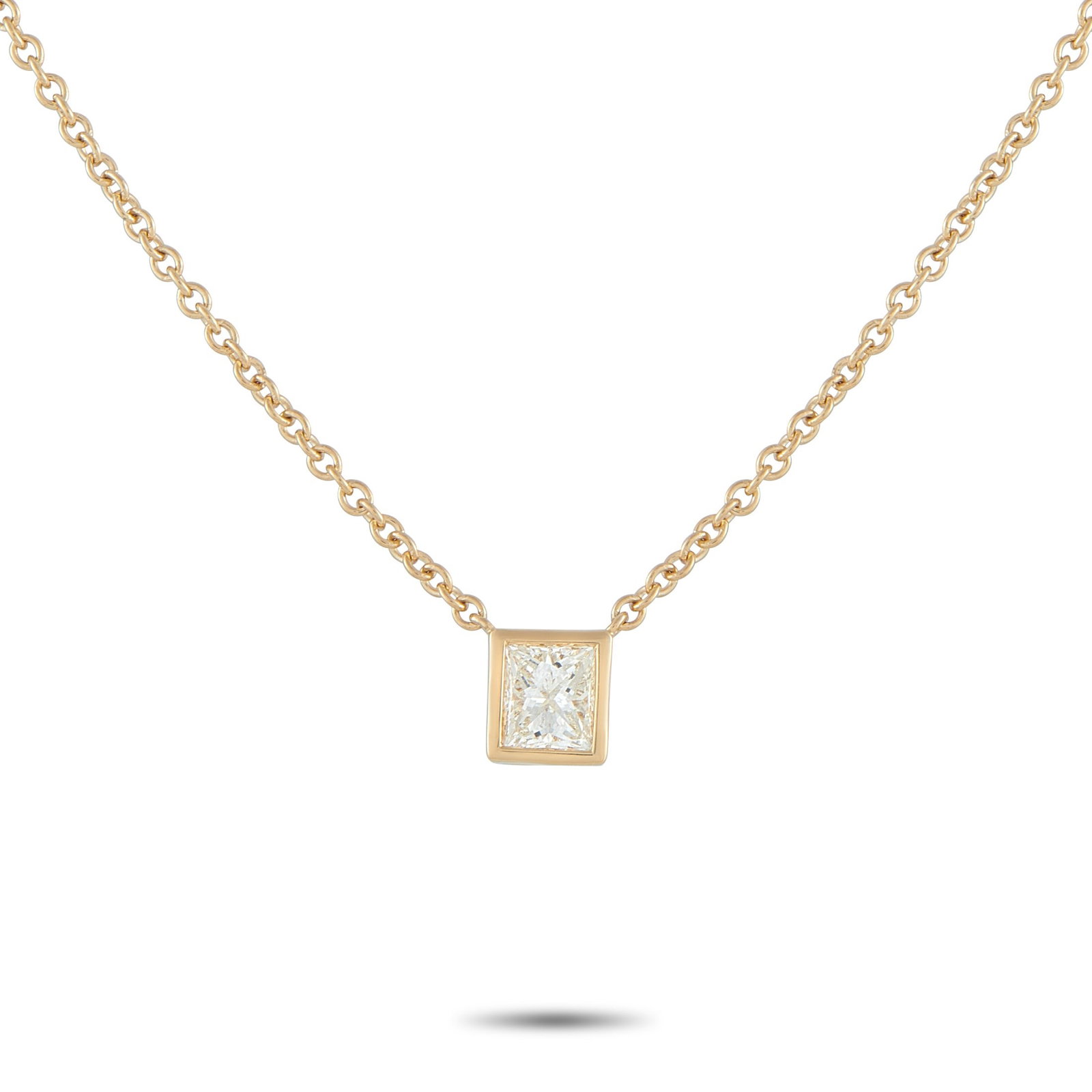 18K Yellow Gold 0.60ct Princess-Cut Diamond Solitaire Necklace: A simple and refined piece perfect for daily wear. A sharp, square princess-cut diamond takes center stage, its facets catching light with crisp, geometric brilliance. It is held securely by a smooth 