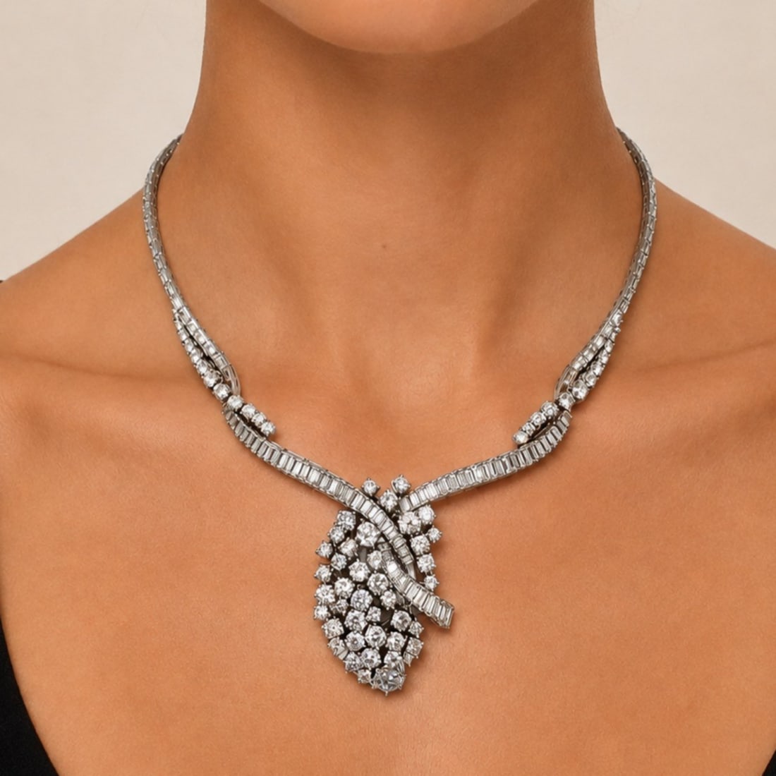 Art Deco Platinum Necklace with 32.50 CTW in Diamonds: Art Deco platinum necklace set with 162 baguette diamonds totaling approx. 21.00 ctw and 73 round diamonds totaling approx. 11.50 ctw for a combined approx. 32.50 ctw (D?F color, VVS?VS clarity). Leng