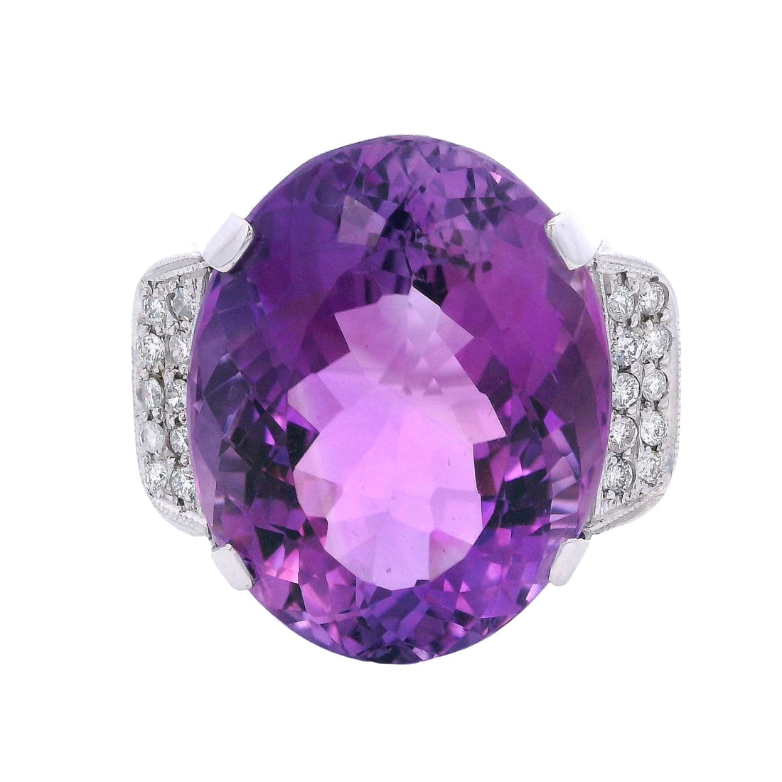 18K White Gold Cocktail Ring with 36.40 CTW in Amethyst & Diamond: 18K white gold cocktail ring featuring a commanding amethyst centerpiece weighing approximately 36.0 carats, elegantly accenter by 20 diamonds totaling approximately 0.40 carats (H color) for a refine