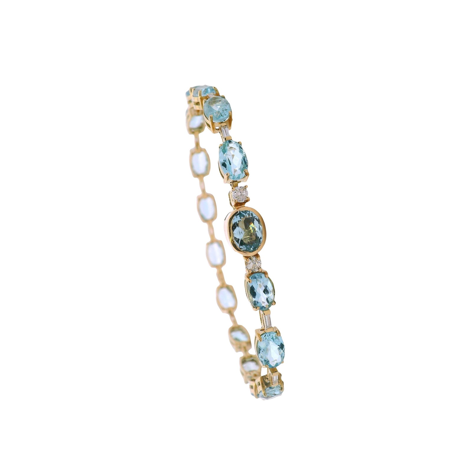 18K Yellow Gold Bracelet with 26.00 CTW in Aquamarine & Diamond: 18K yellow gold aquamarine & diamond bracelet, weighing 12.0 grams, set with 16 oval Brazilian aquamarines totaling approx. 13.50 cts for luminous, ocean-blue color along the wrist. Accenter by 14 bag