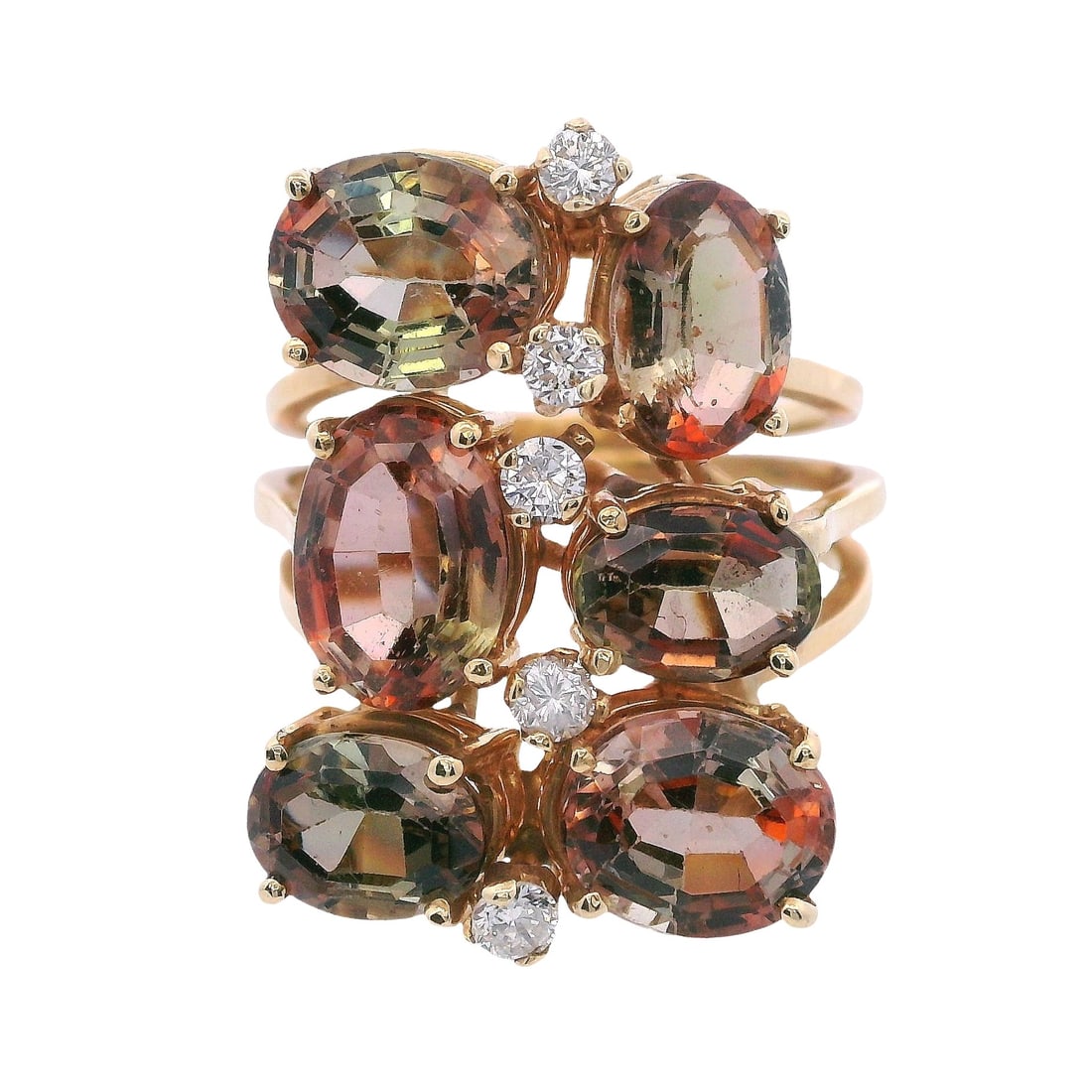 18kt yellow Gold Andalusite & Diamonds Ring: Vintage Cocktail Ring crafted from 18kt yellow Gold, accenter with six Old cut Oval Andalusite weighing together Approx. 8.00 carats. Along with five Round cut Diamonds weighing Approx. 0.32 carats. H