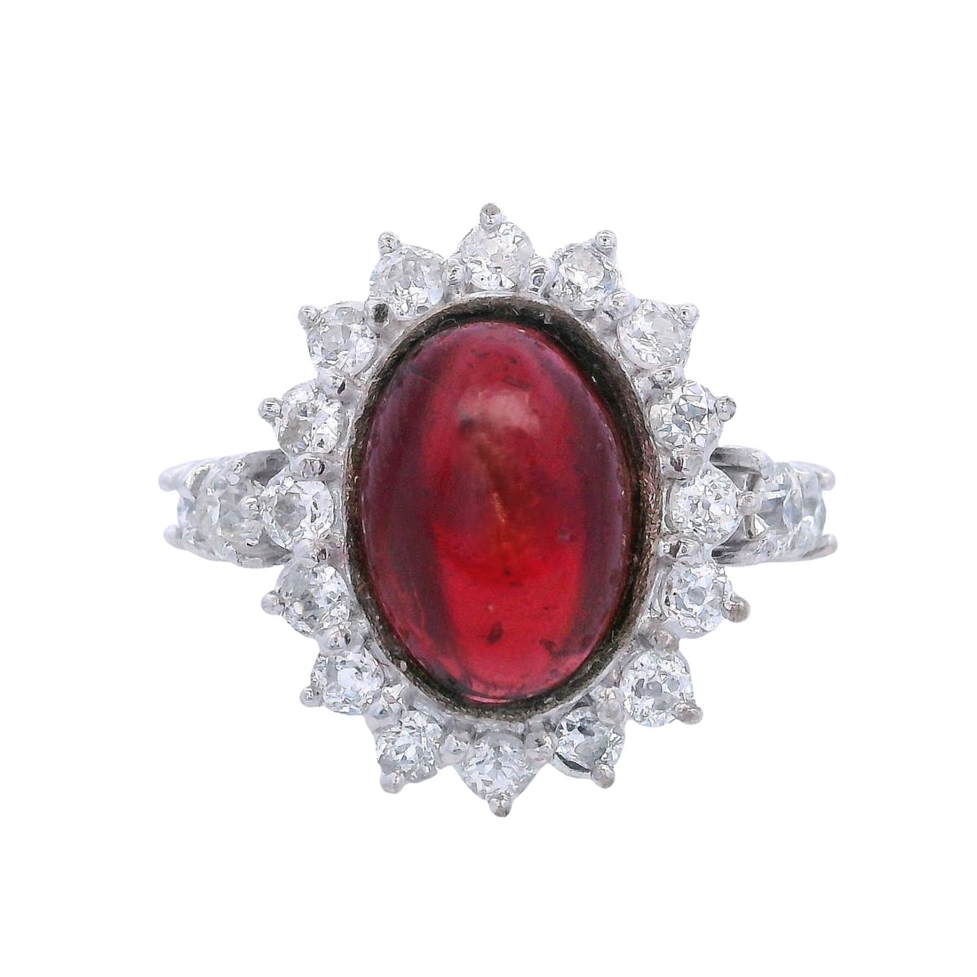 18kt white Gold Cocktail Ring with 6.25 CTW in Garnet & Diamonds: Cocktail 18kt white Gold Ring featuring a center cabochon Garnet of Approx. 5.0 carats. Surrounded by Round by 20 Old mine cut Diamonds weighing Approx. 1.25 carats. H-K color, VS2-SI1 clarity. Ring s