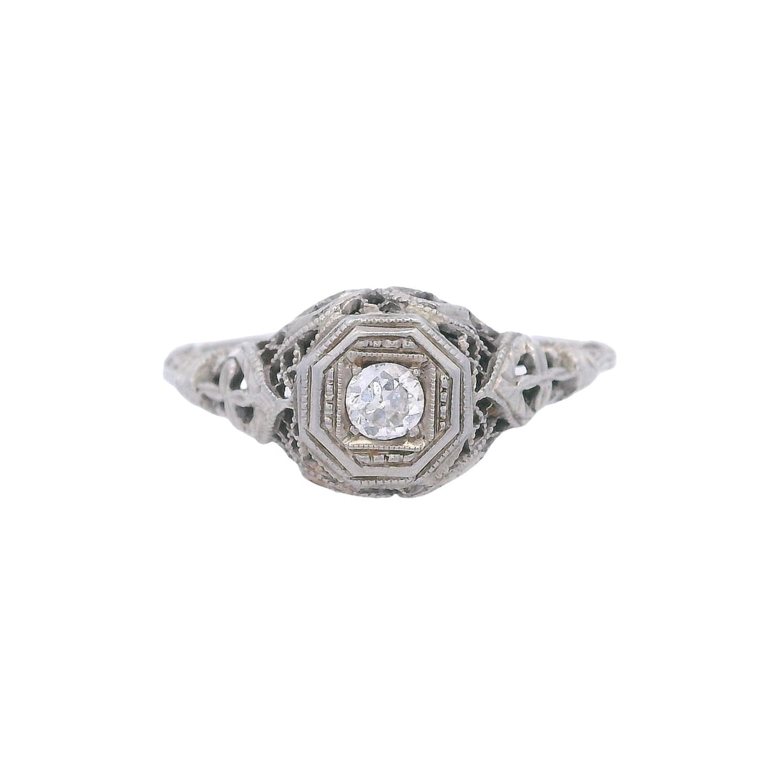 Vintage 18kt white Gold Engagement Ring with Diamond: Vintage Engagement Filigree Ring crafted from 18kt white Gold, featuring a center Round cut Diamond of Approx. 0.12 carats. H color, VS1 clarity. Ring size: 7. Total weight: 2.1 grams. Ring width: 0.3