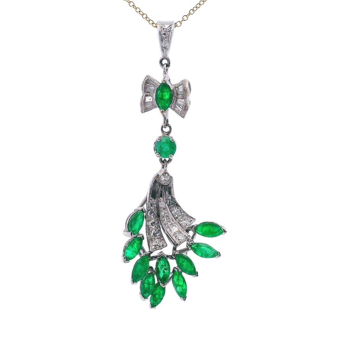 18kt Gold Pendant with Emeralds and Diamonds: Retro 18kt white Gold Pendant featuring graduated Single cut Diamonds and Baguette cut Diamonds weighing together Approx. 0.40 carats. G-H color. Along with 12 Emeralds weighing together Approx. 1.50 