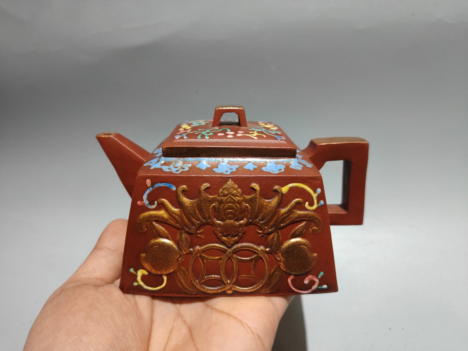 Gilded and colorful longevity teapot: Product Name: Gilded and Colorful Longevity Teapot; Bottom Mark: Dragon and Phoenix Seal; Size: 19 x 9 cm; Capacity: 360 cc; Clay: Original Red Clay Provenance:from the collection of George Stopher, K