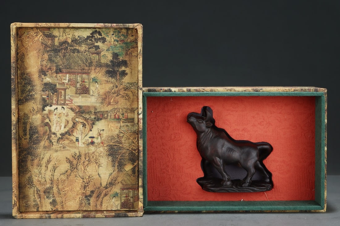 Agarwood Ox Ornament from the Imperial Collection: A sandalwood ox figurine formerly in the imperial collection, measuring 14.5 cm in length, 5 cm in width, and 13.5 cm in height. Provenance:from the collection of George Stopher, Kent, purchased from