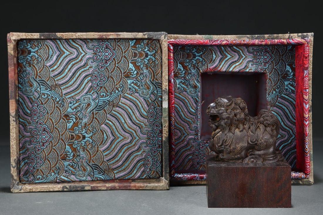 Imperial Collection Agarwood Seal, Eight Treasures, Mao Nian Zhi Bao (cm): A former imperial collection agarwood seal, inscribed with the Eight Treasures, measuring 8.3 cm in length, 8.3 cm in width, and 10.5 cm in height. Provenance:from the collection of George Stopher,