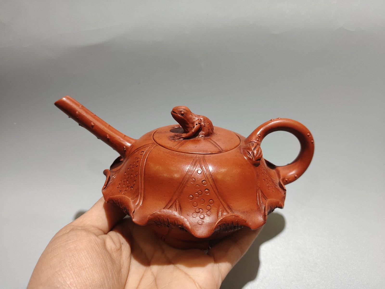 Frog Lotus Leaf Pot: Product Name: Frog and Lotus Leaf Teapot; Bottom Mark: Jiang Yanting; Size: 18 x 9 cm; Capacity: 320cc; Clay: Original Red Clay Provenance:Private collection from a professor in University of