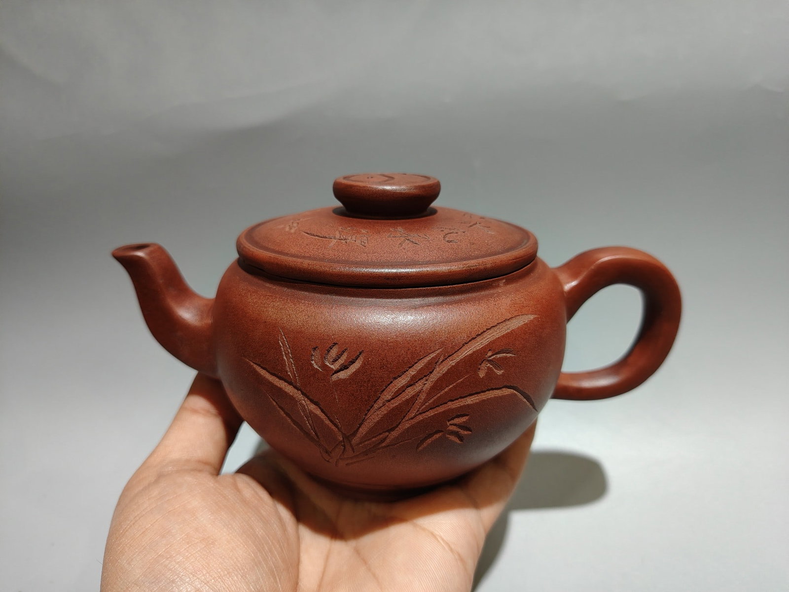 Tai Chi Engraved Teapot: Product Name: Tai Chi Engraved Teapot; Bottom Mark: Chen Mansheng, Amantuo Studio; Size: 18 x 10 cm; Capacity: 280 cc; Clay: Original Red Clay Provenance:Private collection, Liverpool, The United