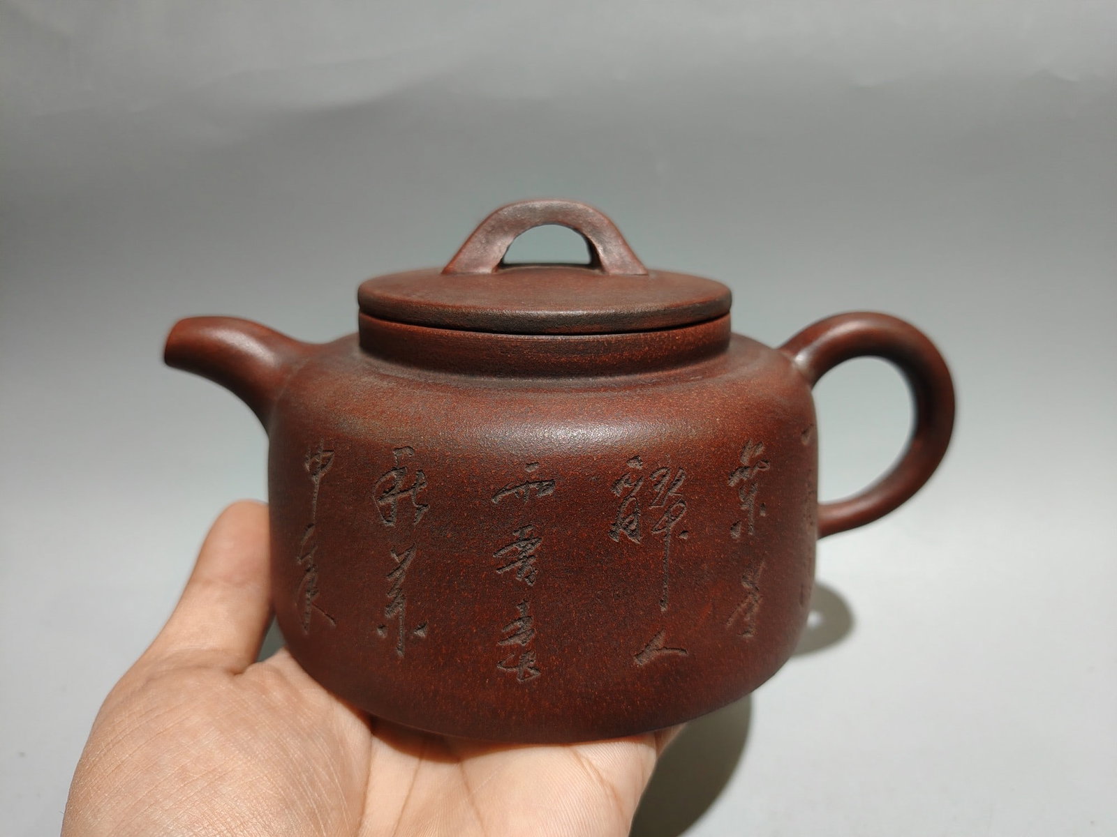 Inscribed Half-Moon Teapot: Product Name: Crescent Moon Teapot with Engraved Mark: Chen Mingyuan Size: 18 x 10 cm Capacity: 400cc Clay: Original Red Clay Provenance:Private collection, Liverpool, The United Kingdom. We have an