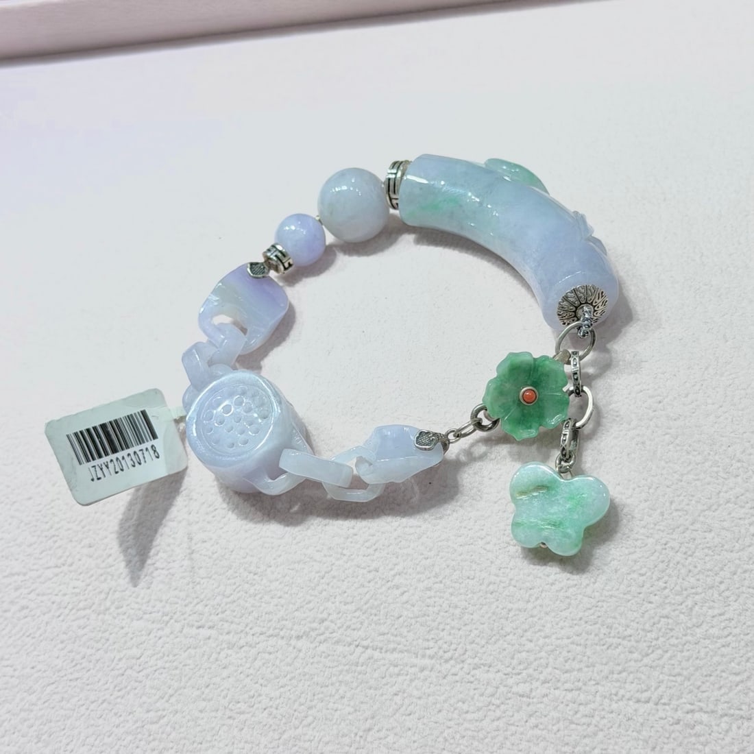 Natural jade ruyi bracelet: Natural jadeite ruyi bracelet with 925 sterling silver accessories. Provenance:From an old private collection in Cotswold, United Kingdom.? We have an in-house shipping department to ensure your post-