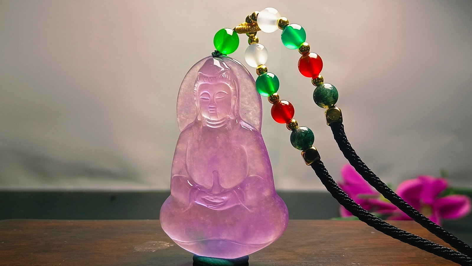 Dragon Stone Type Violet Jadeite Guanyin Pendant: Dragon Stone Type Violet Jadeite Guanyin Pendant Provenance:Private collection from a professor in University of Cambridge. We have an in-house shipping department to ensure your post-purchase process